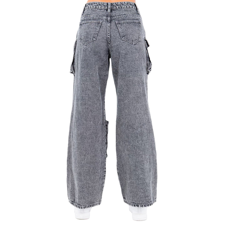 a woman wearing a pair of grey jeans
