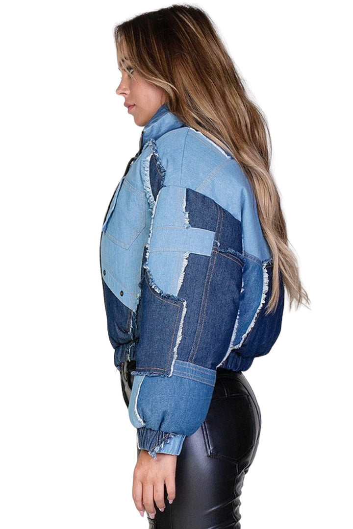 a woman wearing a jean jacket and black leather pants