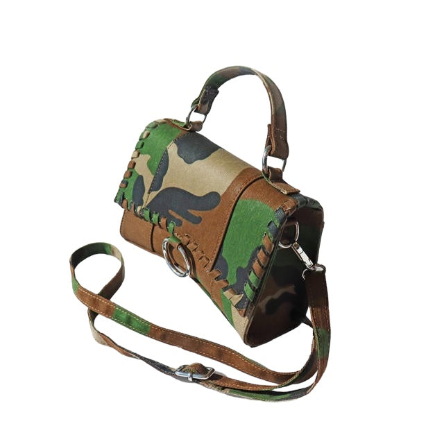 a small purse with a dinosaur pattern on it