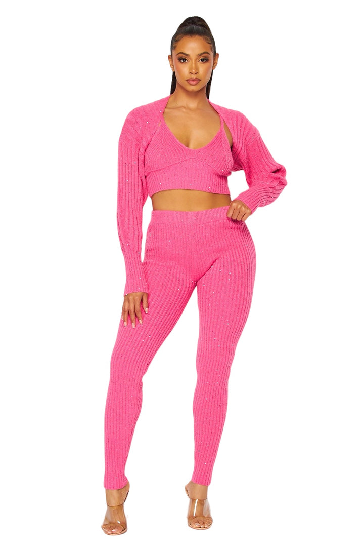 a woman in a pink sweater and matching pants