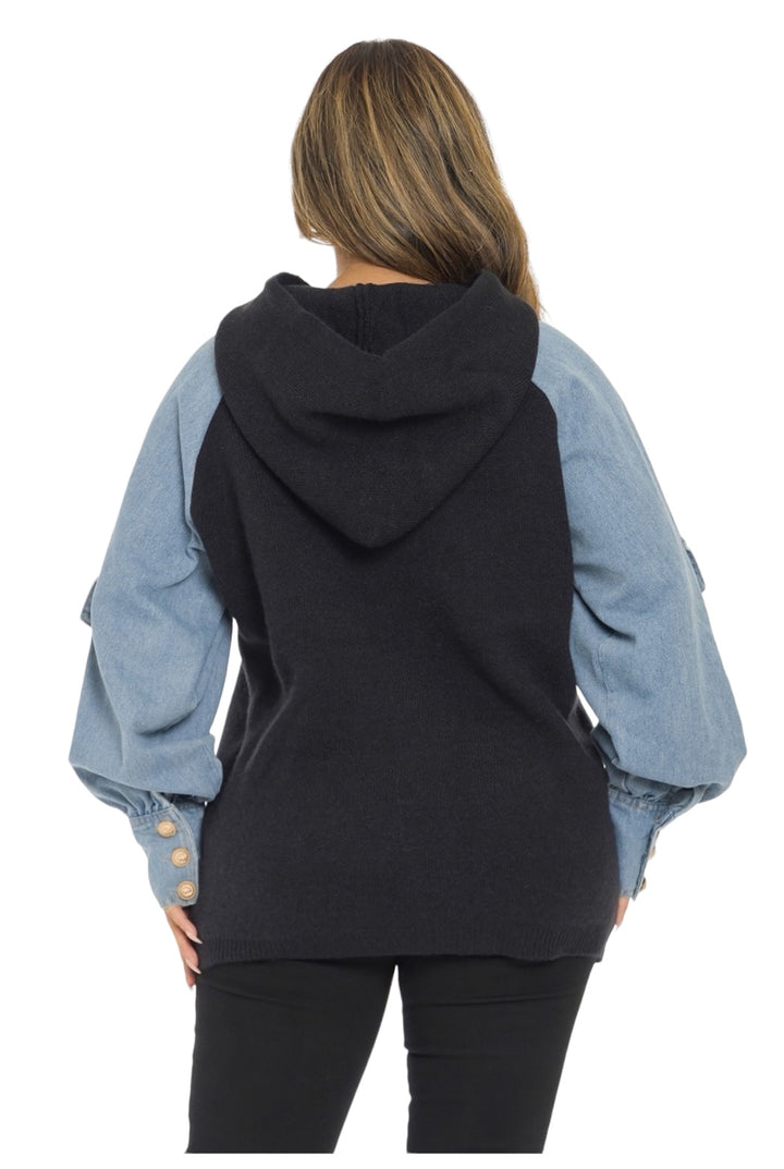 the back of a woman wearing a black hoodie