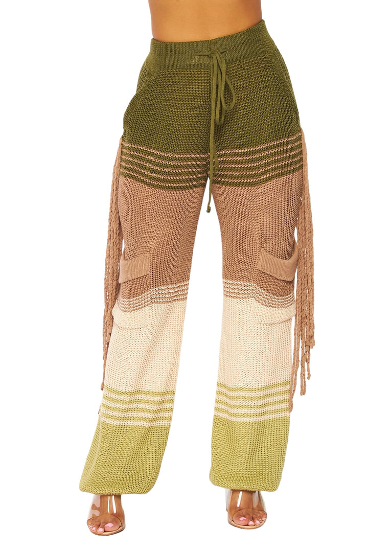a woman wearing a pair of pants with fringes