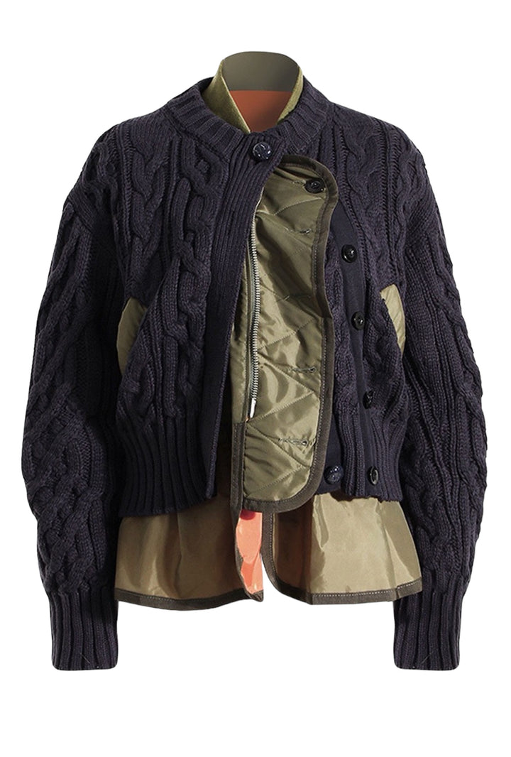 a jacket that has a zipper on the back of it
