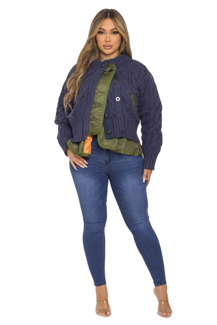 a woman wearing a purple cardigan sweater and jeans