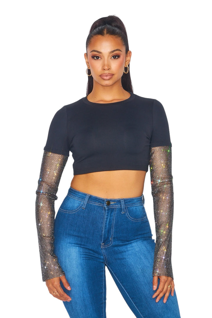 a woman wearing jeans and a crop top