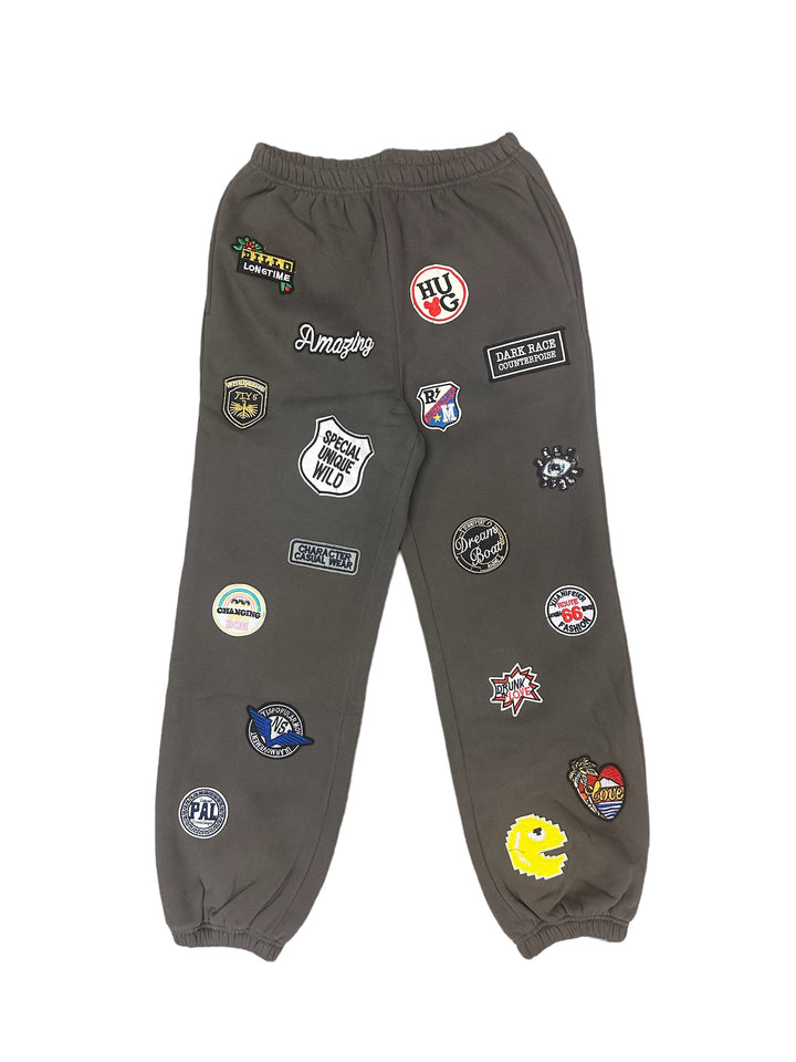 a pair of grey pants with patches on them