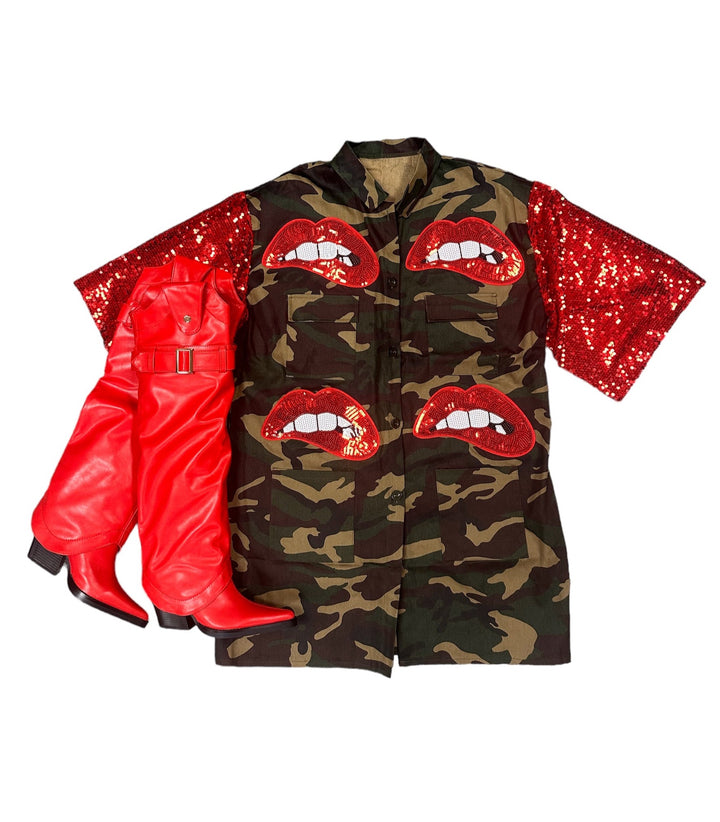 a camouflage jacket with red sequins and red lips