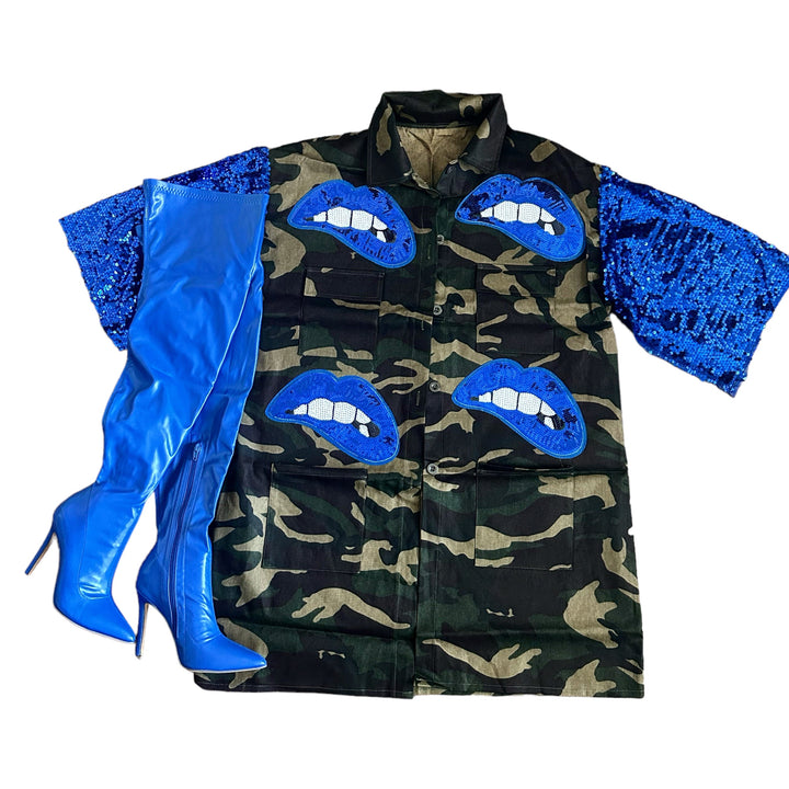a camouflage jacket with blue lips and sequins on it