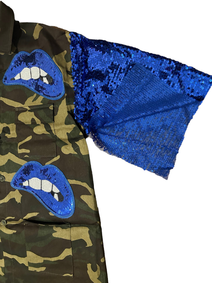 a camouflage jacket with blue sequins on it