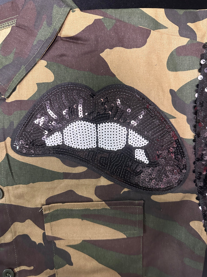 a pair of shoes that are on a camouflage shirt
