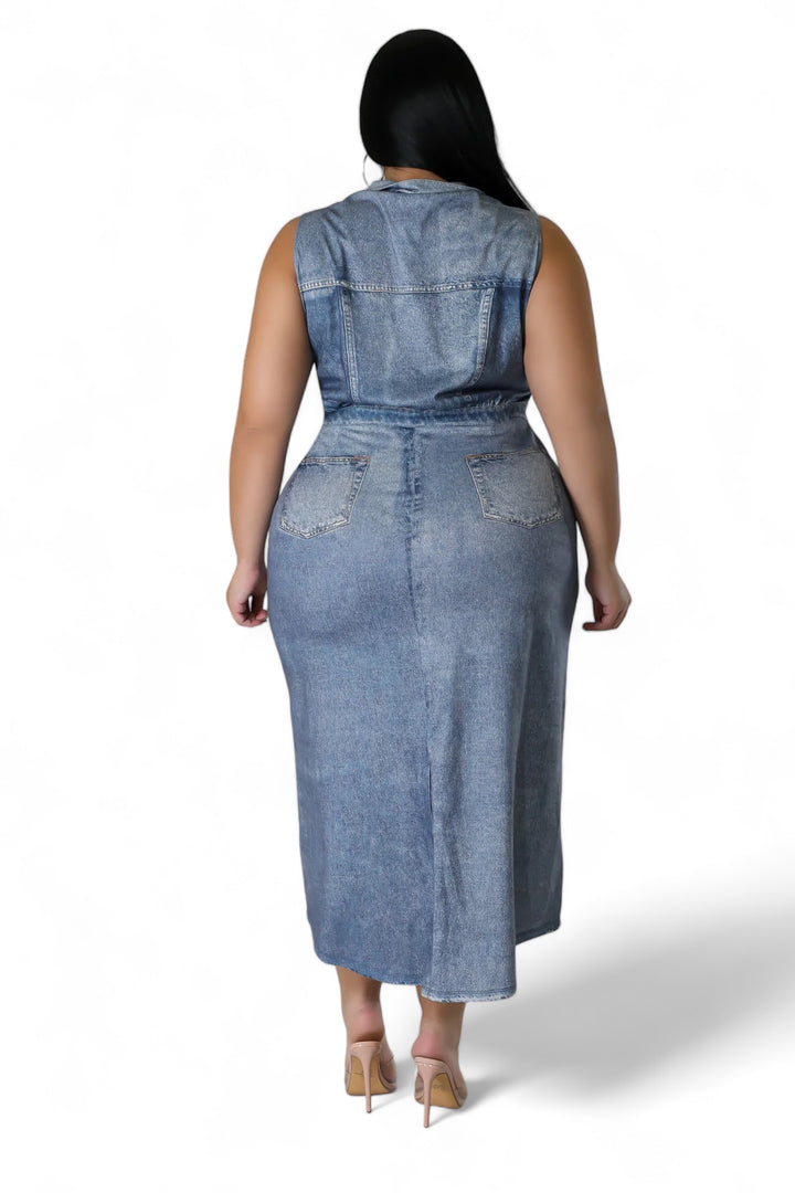 a woman wearing a denim dress and heels