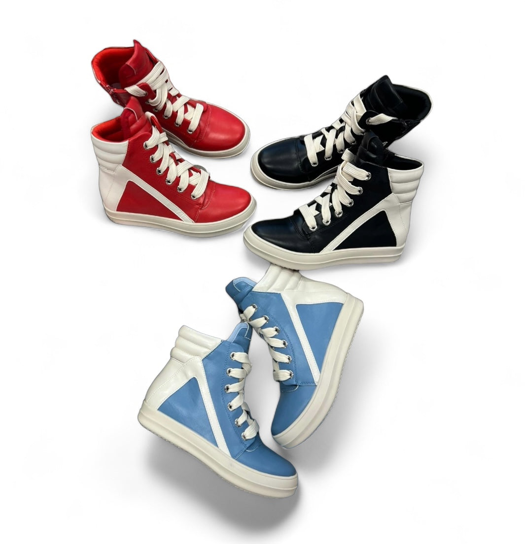 a group of four pairs of shoes sitting on top of each other