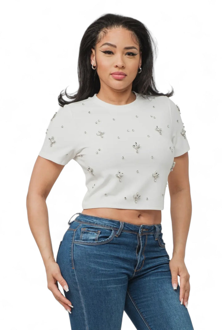 a woman wearing jeans and a crop top