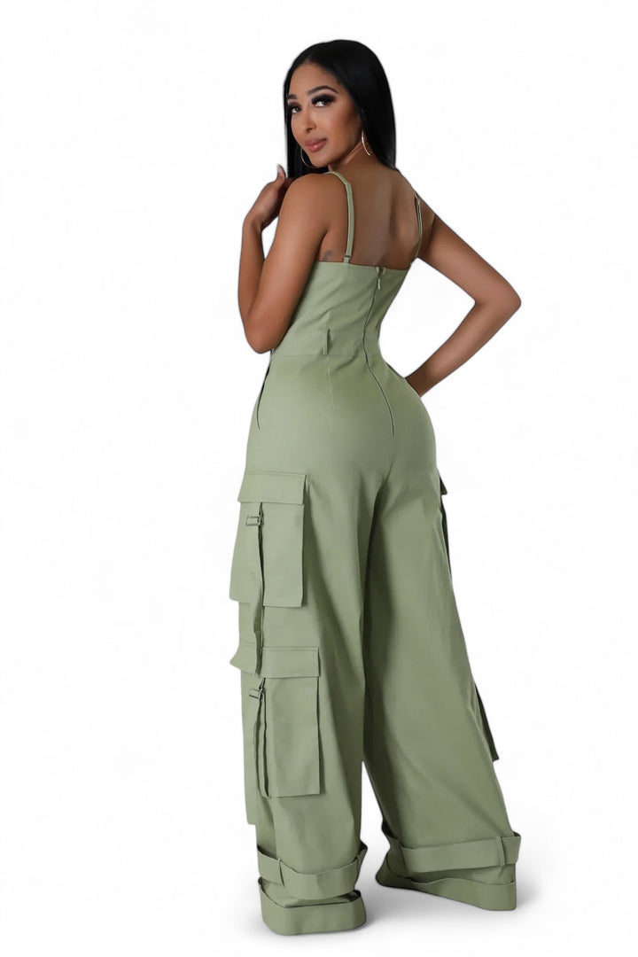 the sideview of a woman wearing an olive cargo jumpsuit