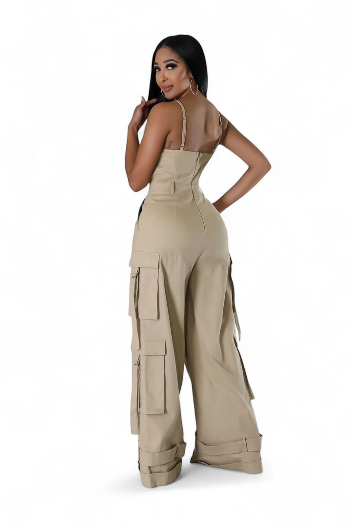 the sideview of a woman wearing a tan cargo jumpsuit