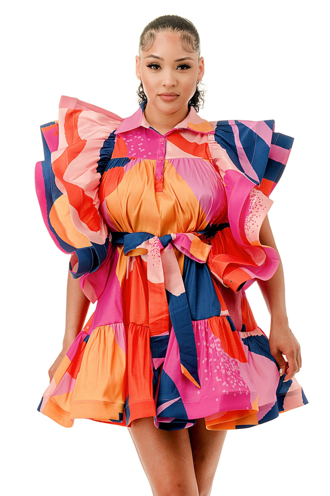 a woman in a colorful dress posing for a picture