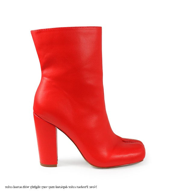 a pair of red high heeled boots on a white background