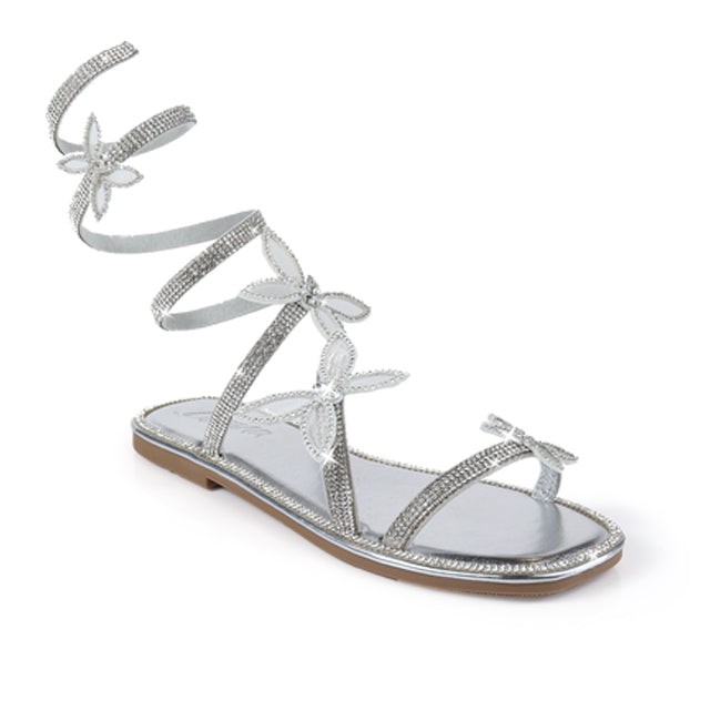 a women's silver sandal with laces and bows