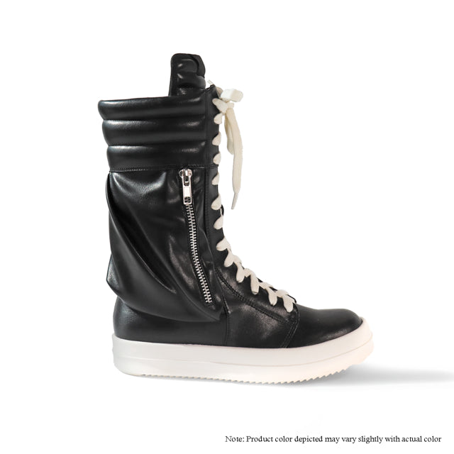 a pair of black and white shoes with zippers