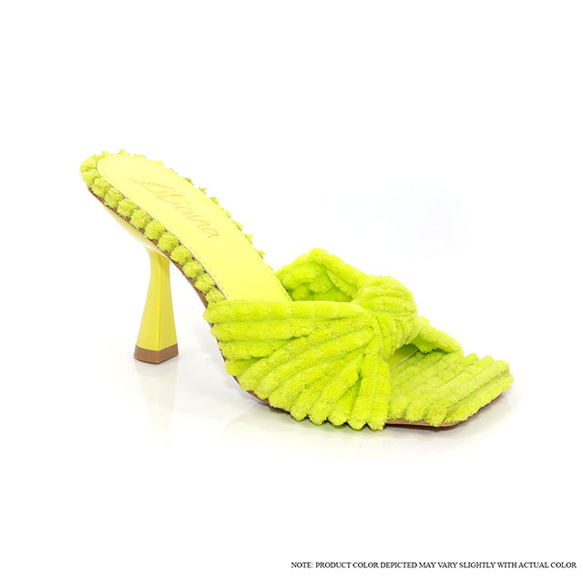 a pair of yellow shoes with a yellow heel