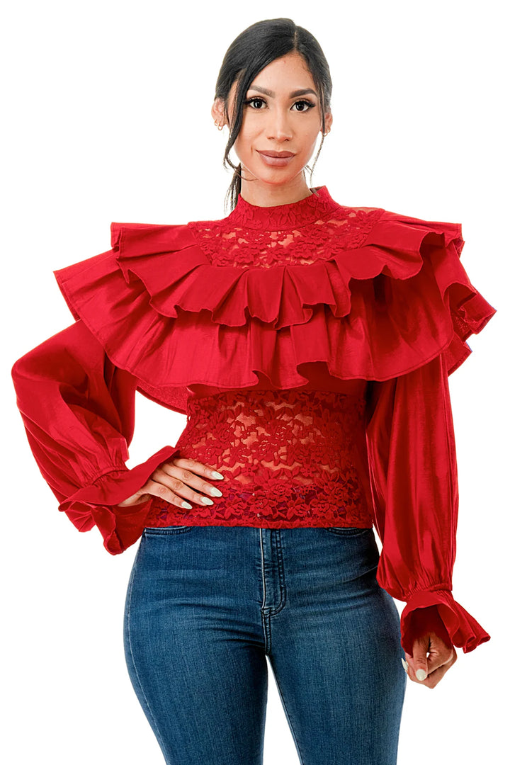 a woman wearing a red top and jeans