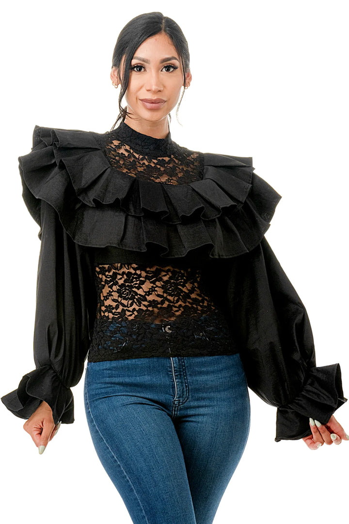 a woman wearing a black top and jeans