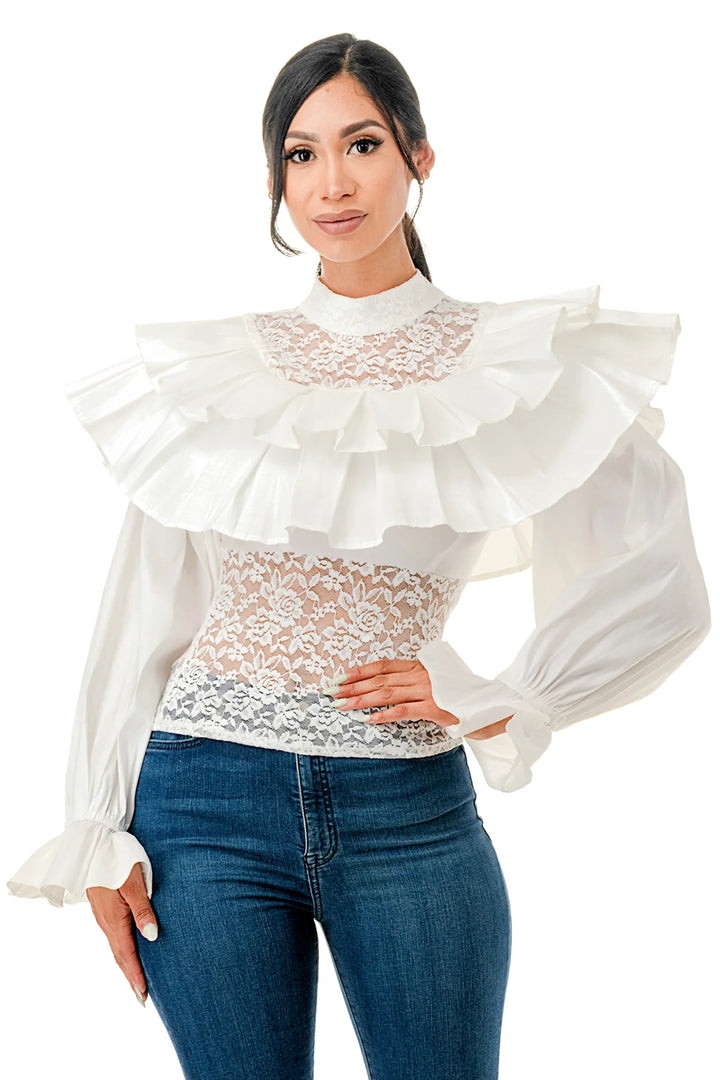 a woman wearing a white top and jeans