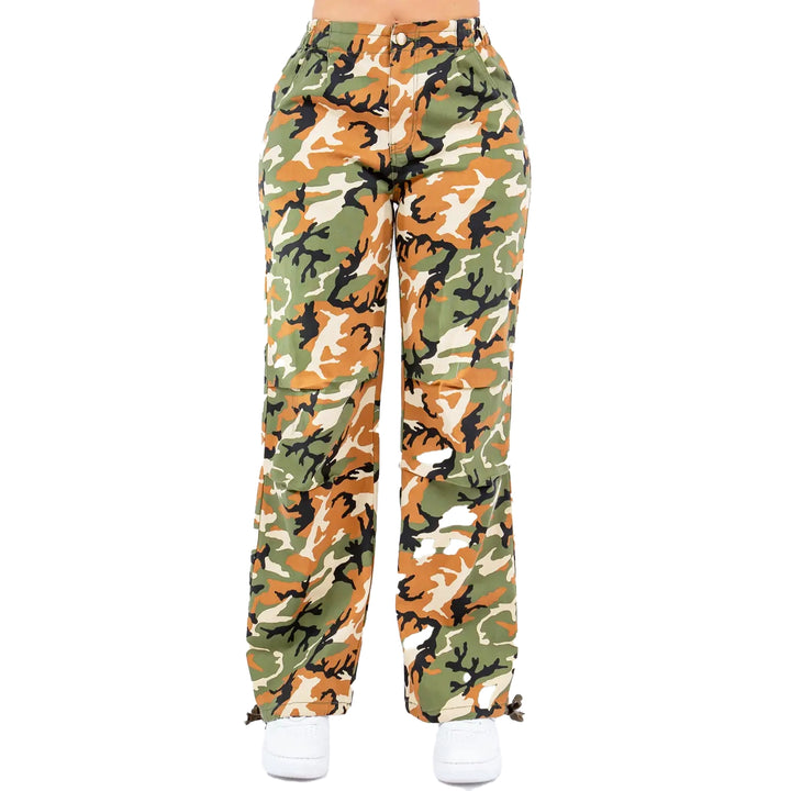 a woman wearing camouflage print pants