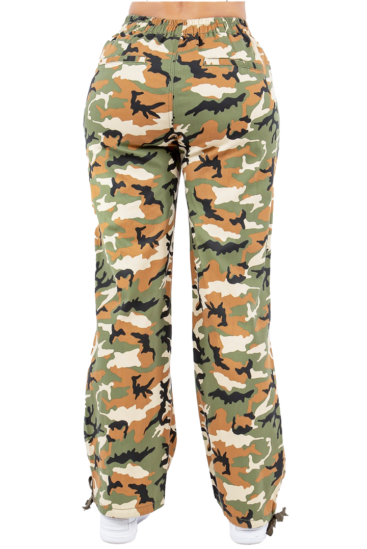a woman in camouflage print pants
