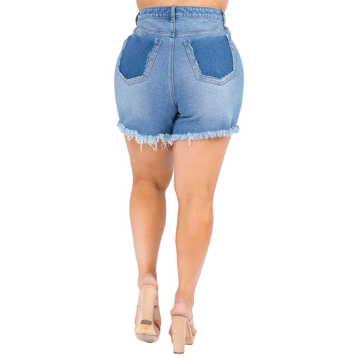 a woman in high rise denim shorts and heels