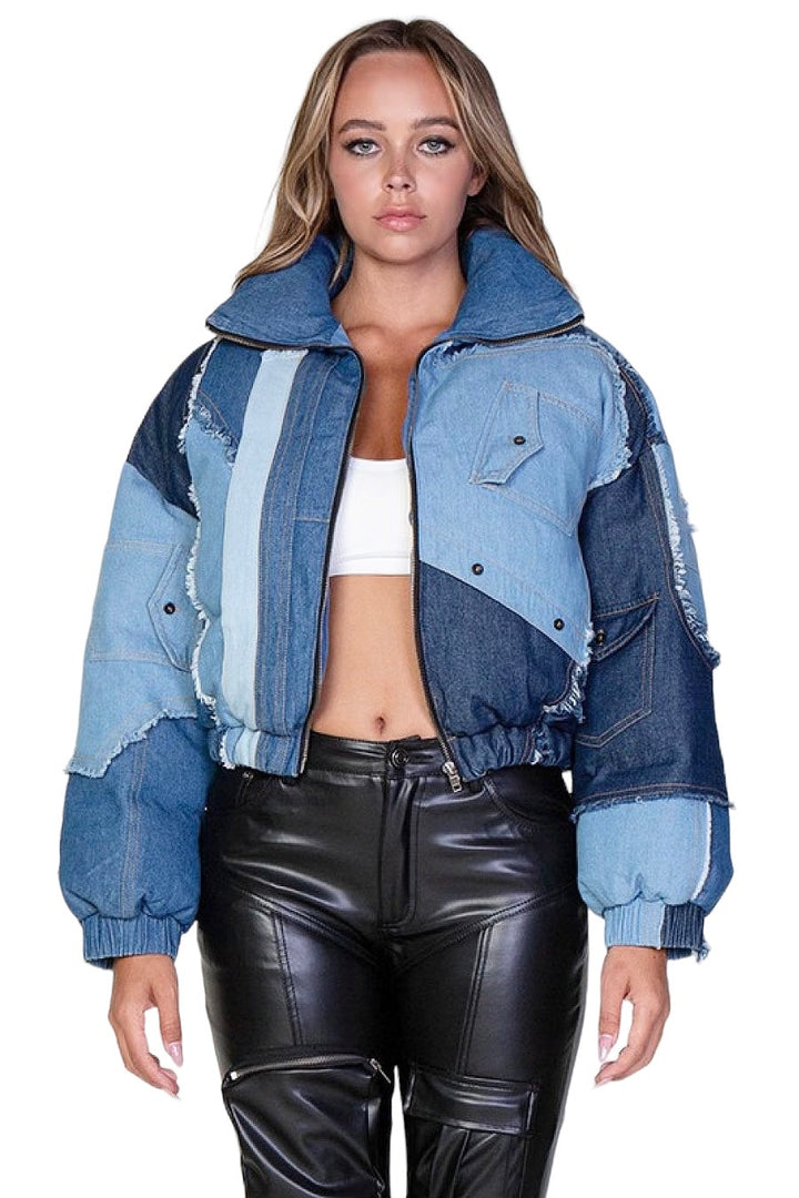 a woman wearing a jean jacket and leather pants