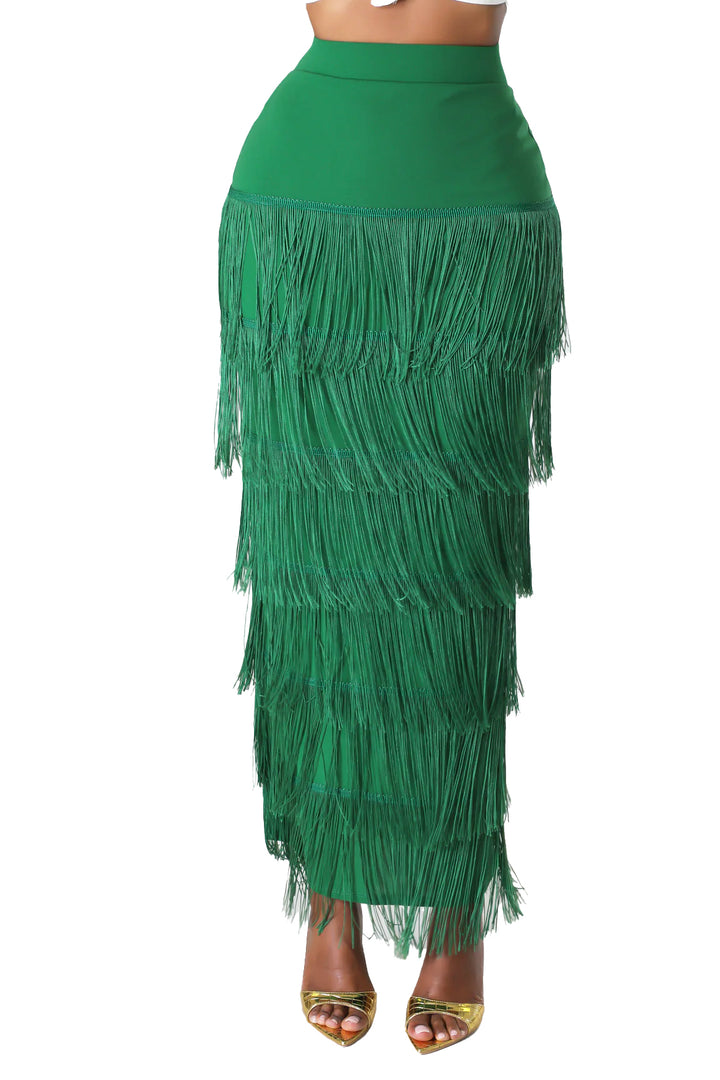 a woman wearing a green skirt with fringes