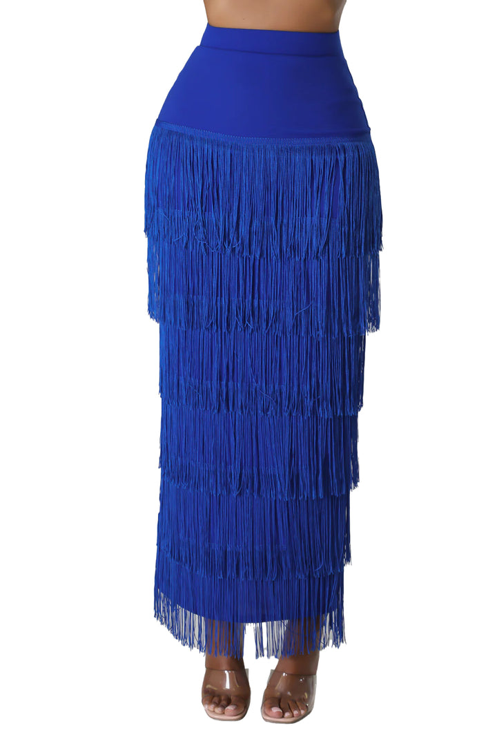 a woman wearing a blue skirt with fringes