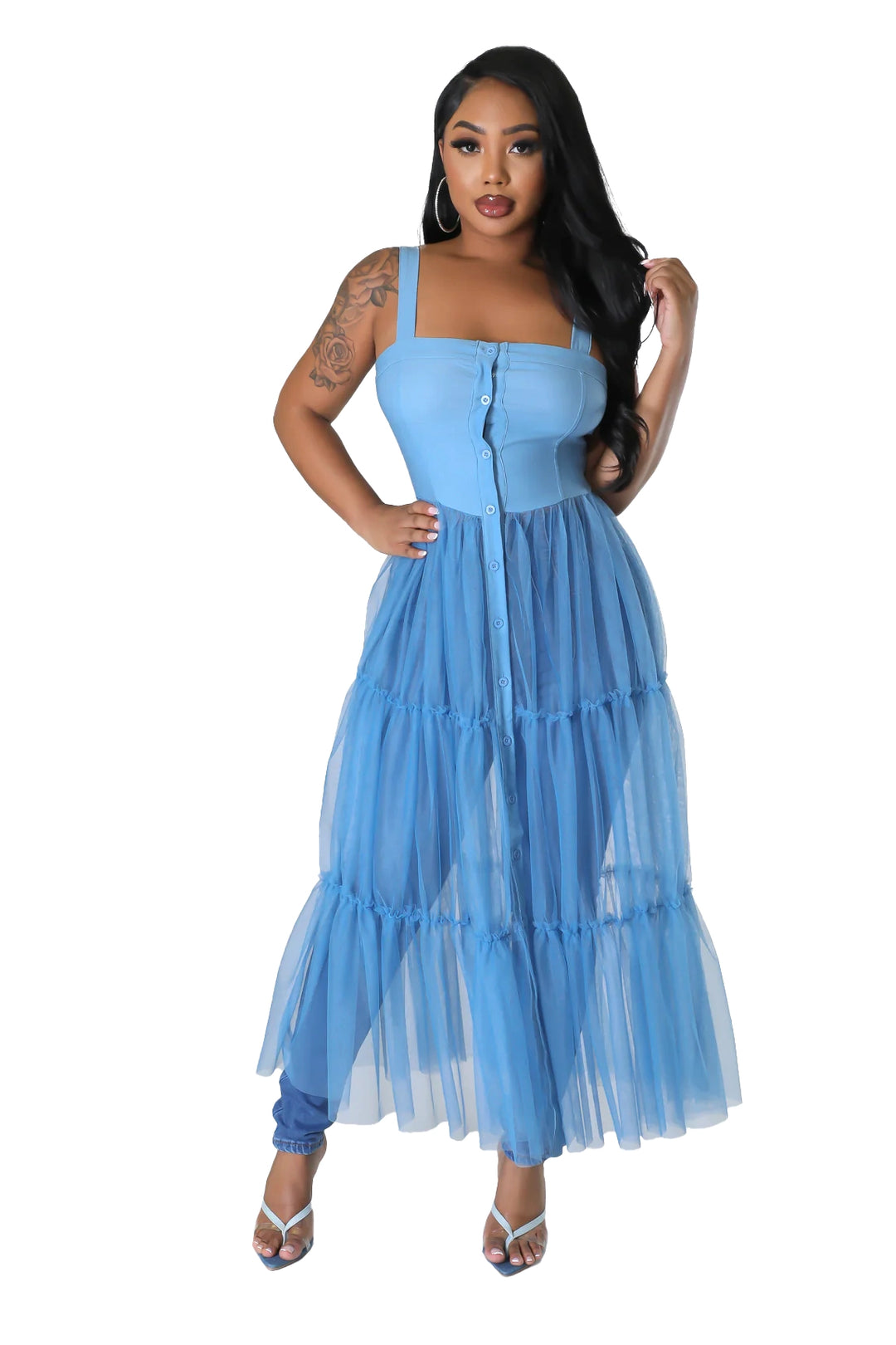a woman in a blue dress posing for a picture