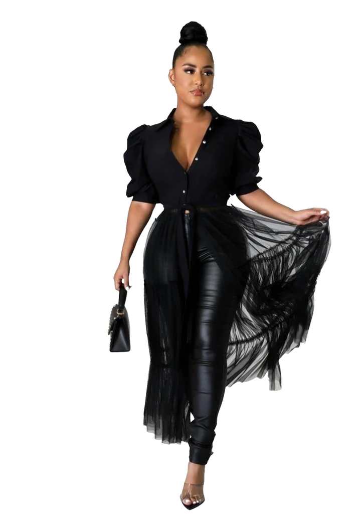 a woman in a black top and black pants