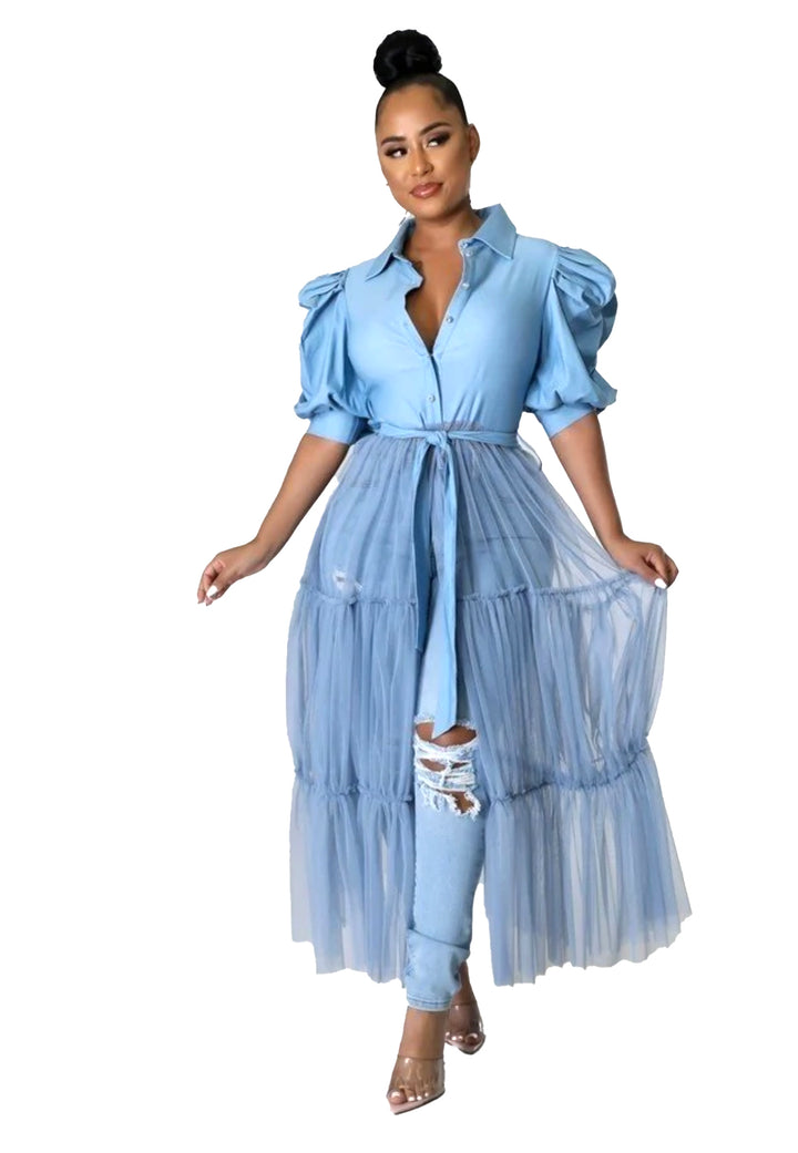 a woman wearing a blue dress and sandals