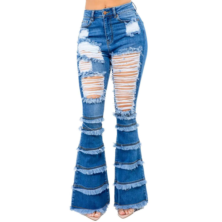 a woman wearing a pair of ripped jeans