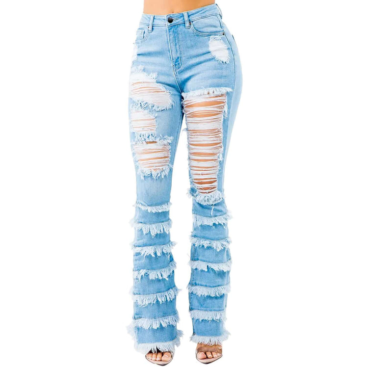 a woman wearing a pair of ripped jeans