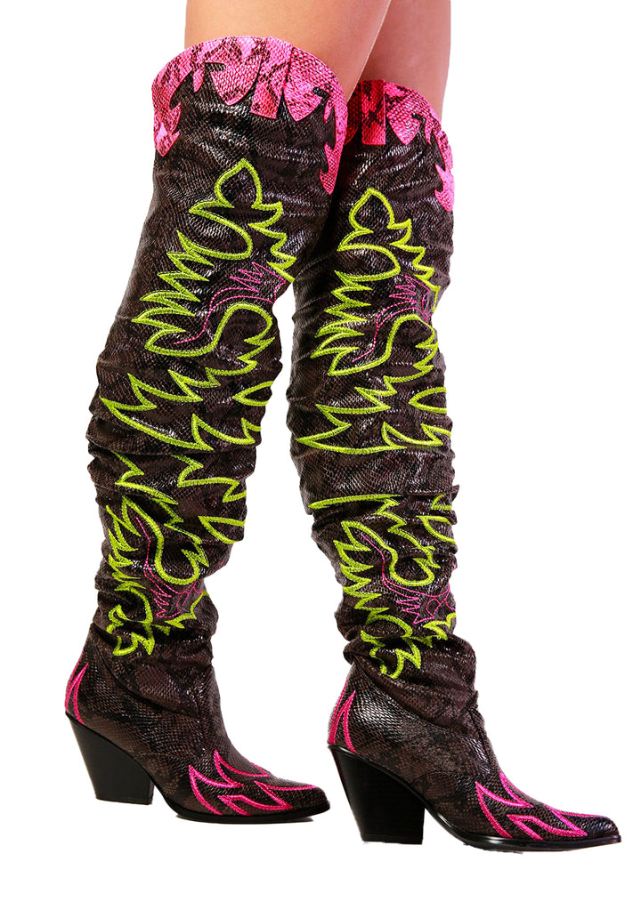 a close up of a person wearing a pair of boots