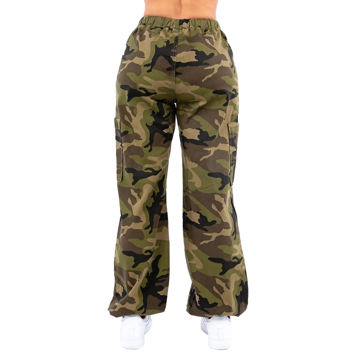 a woman in camouflage print pants with her back to the camera