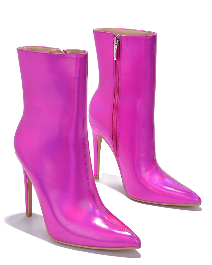 a pair of pink high heeled boots