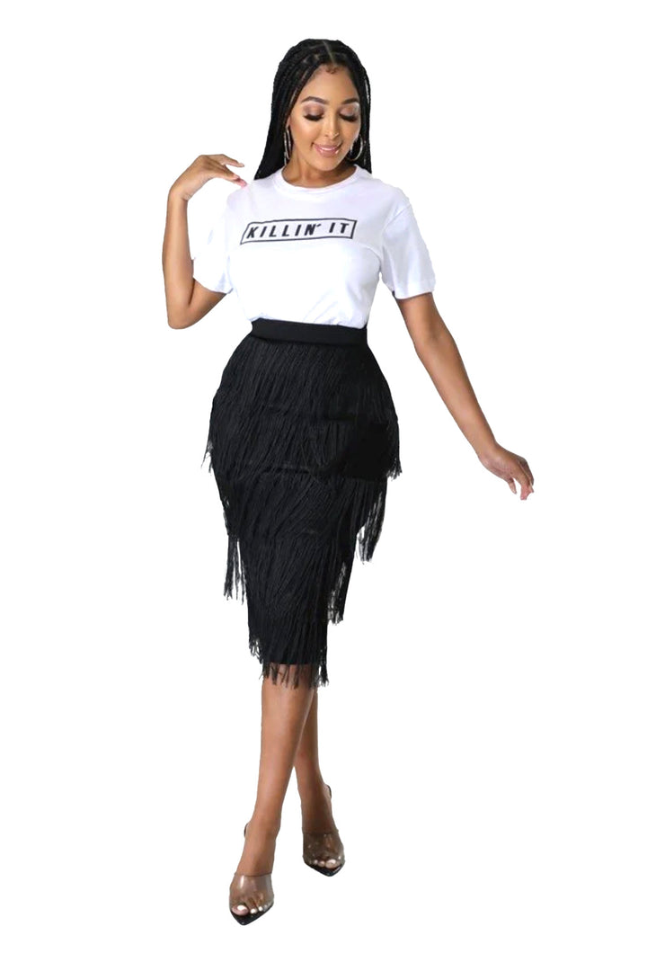 a woman in a white shirt and black skirt