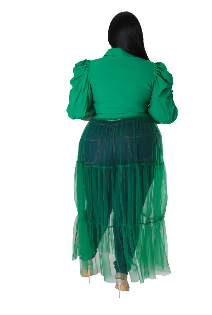 the back of a woman wearing a green dress