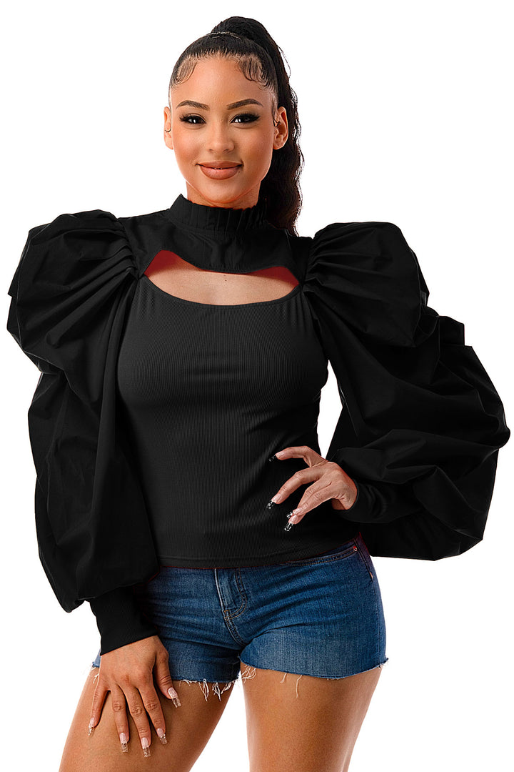 a woman posing for a picture wearing a black top