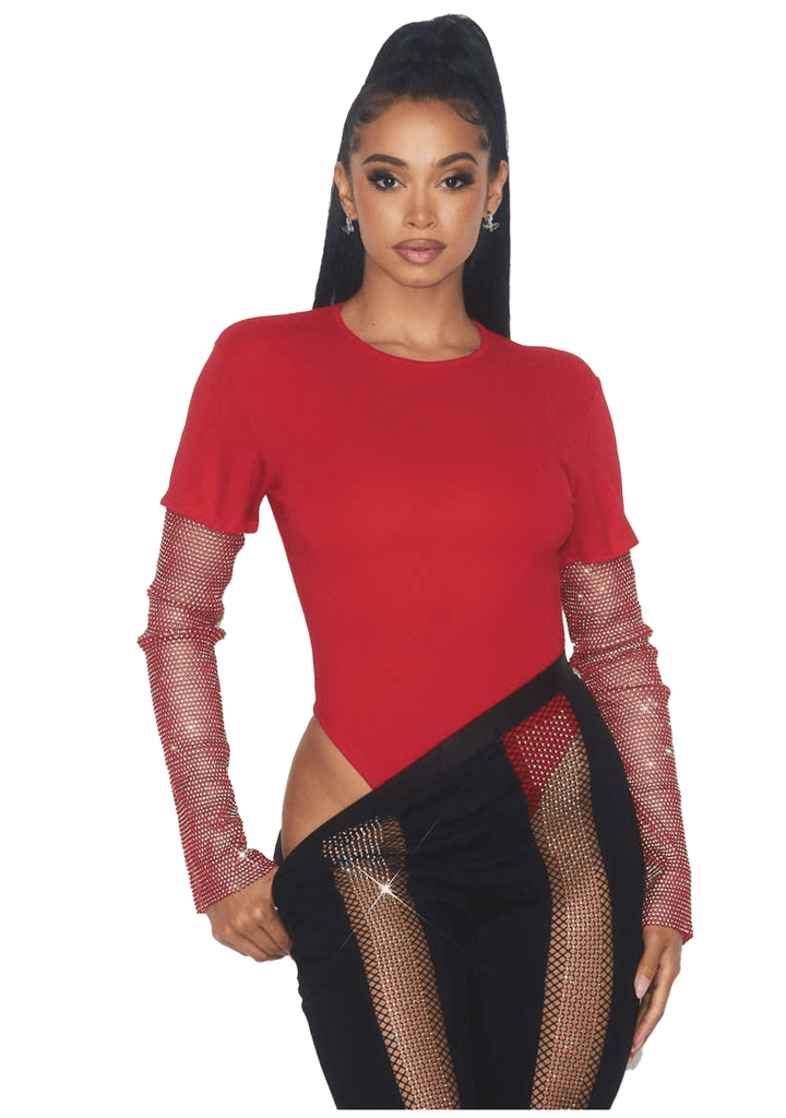 a woman wearing a red top and black pants