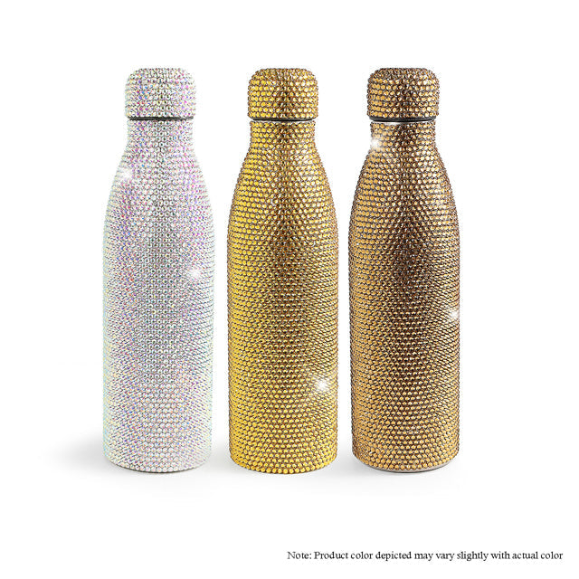 three different colored bottles in a row on a white background