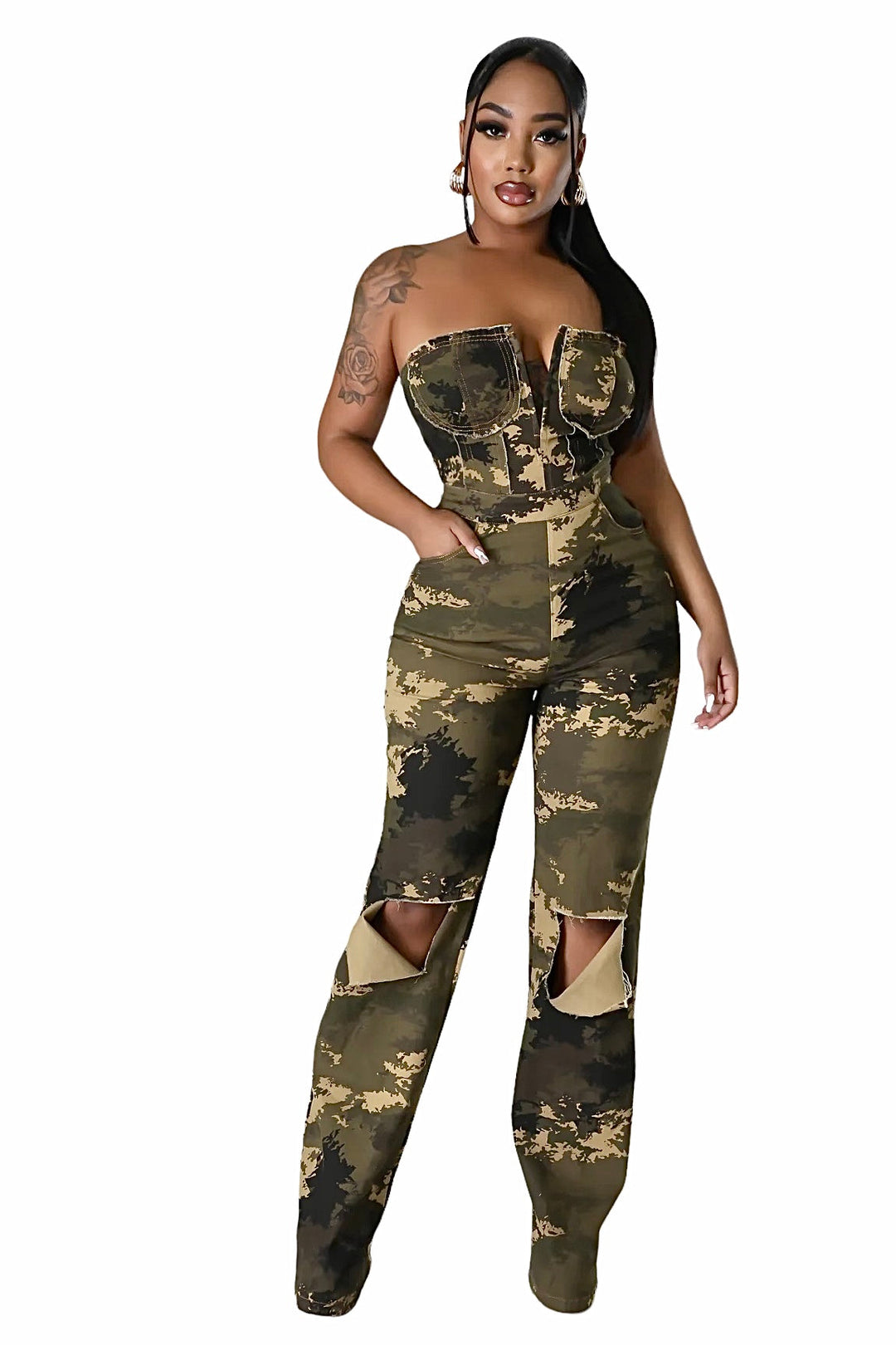 a woman wearing a camo jumpsuit and heels
