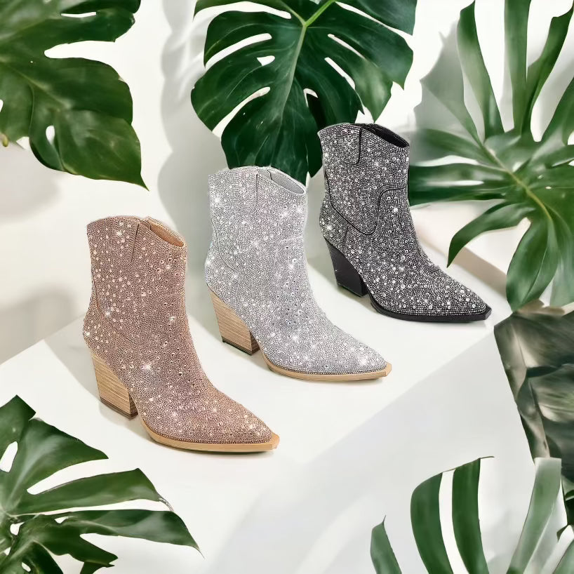 three pairs of glittered ankle high boots