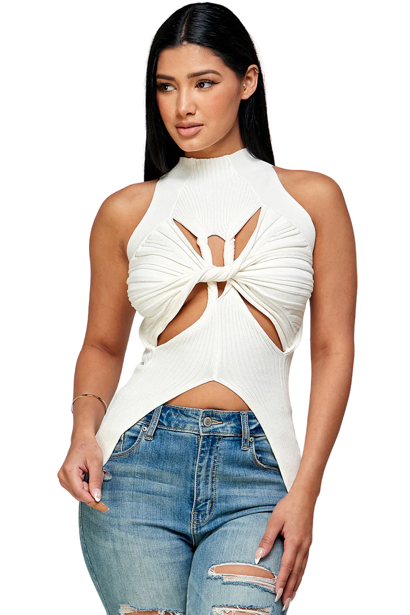 a woman wearing ripped jeans and a white top