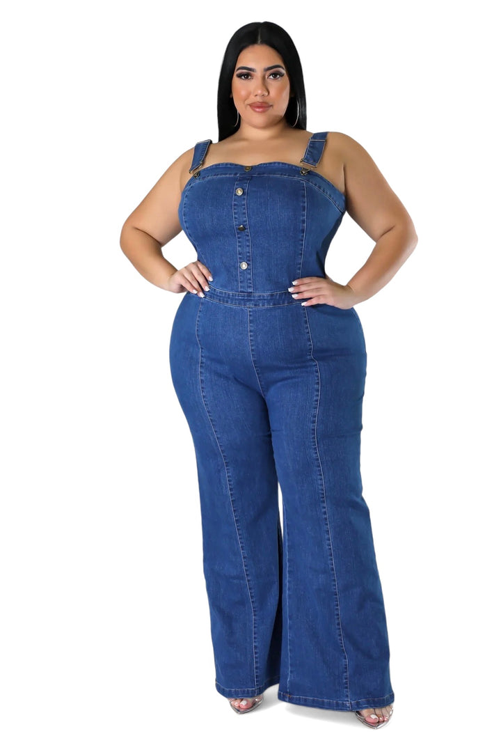 a woman wearing a denim jumpsuit with buttons